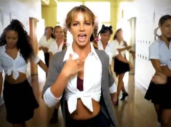 Britney Spears in schoolgirl outfit, from music video, “Baby One More Time”